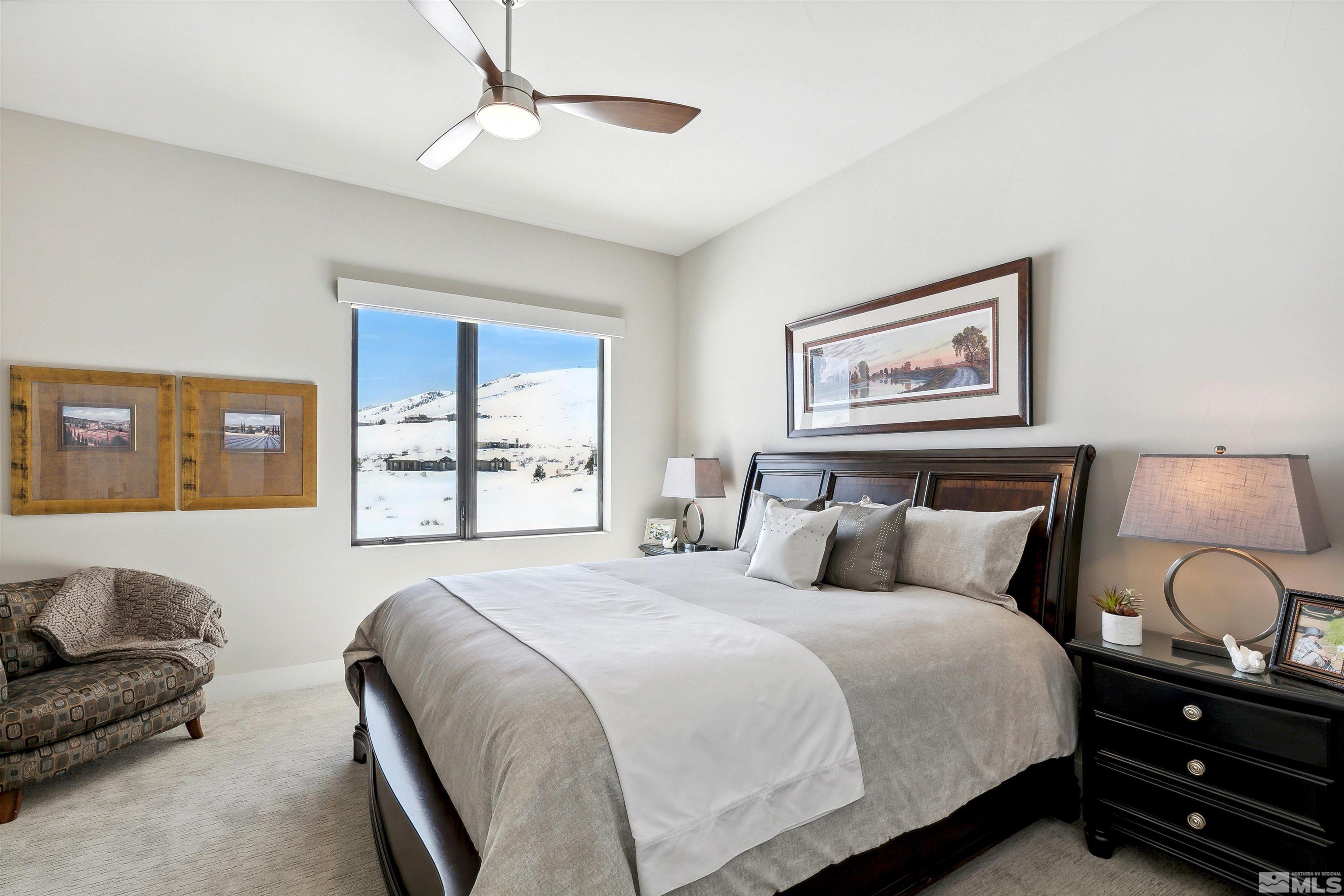 4110 Spotted Eagle Court Reno, NV 89511 - Photo 25 of 40 a bedroom with a bed couch and window