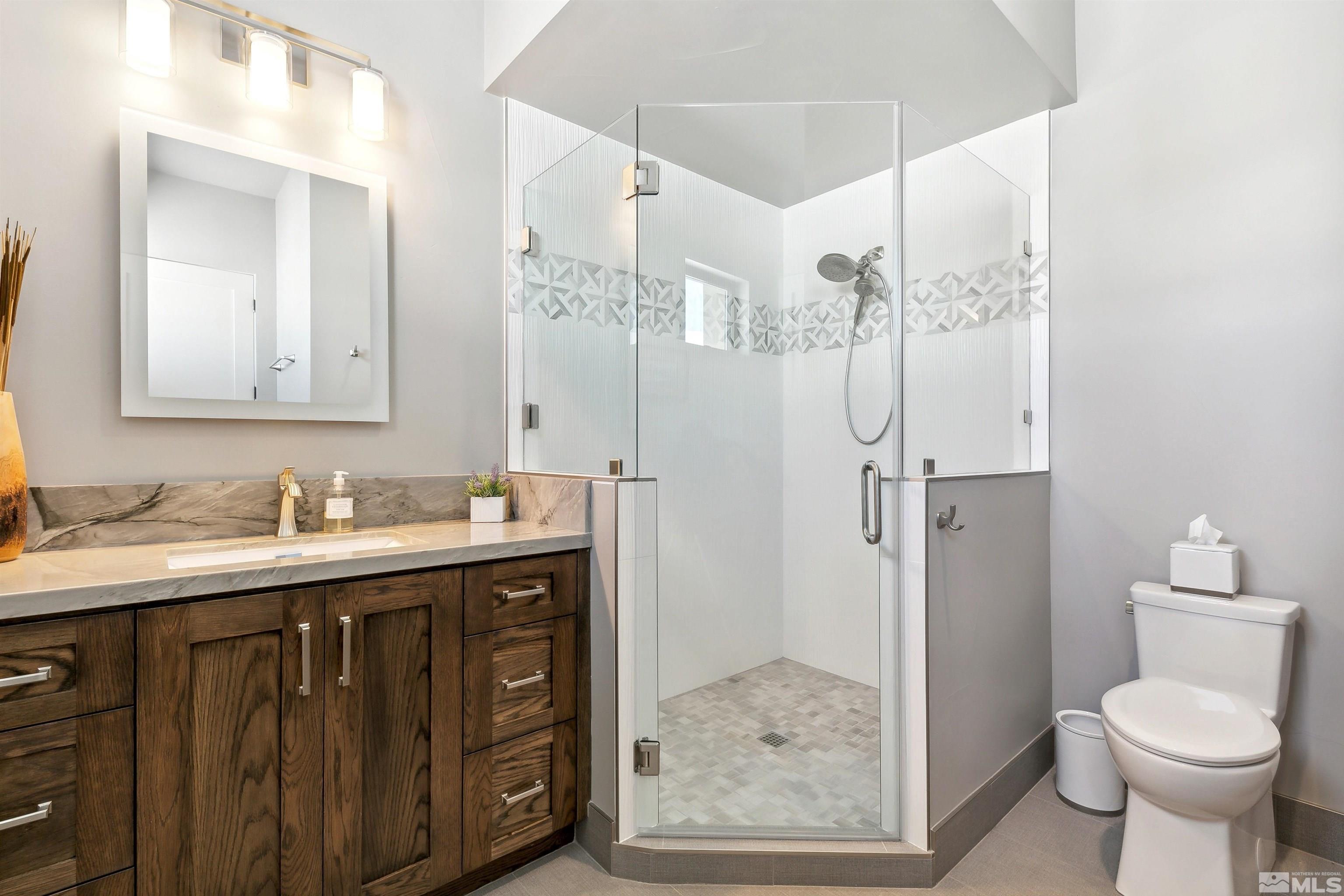 4110 Spotted Eagle Court Reno, NV 89511 - Photo 26 of 40 a bathroom with a sink toilet and shower