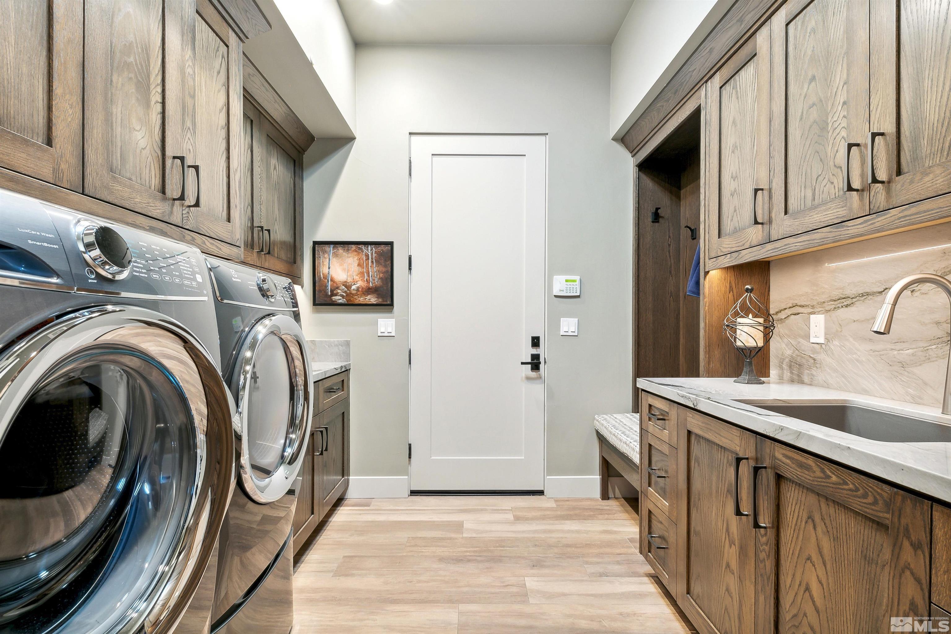 4110 Spotted Eagle Court Reno, NV 89511 - Photo 28 of 40 a utility room with sink dryer and washer