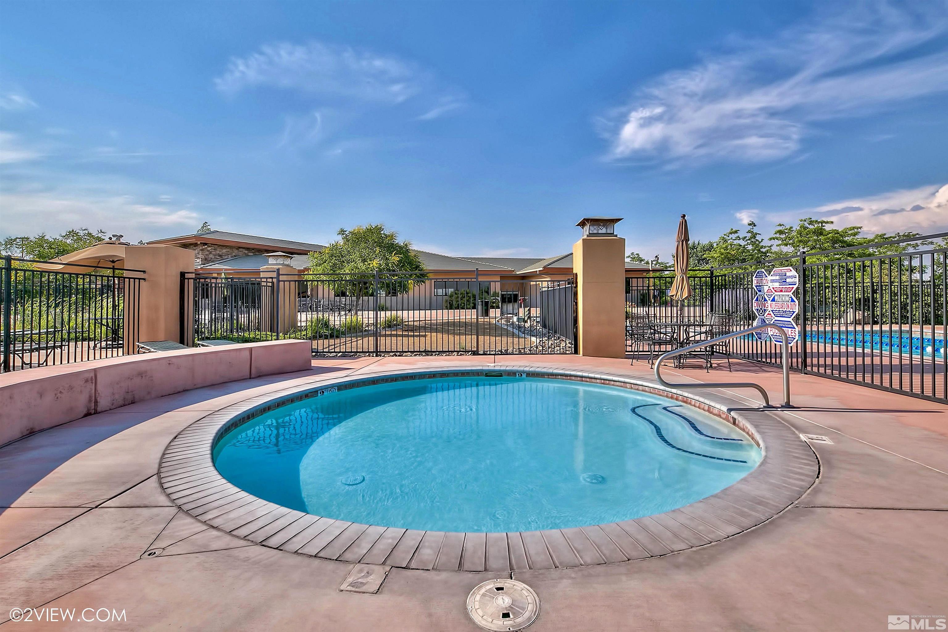 4110 Spotted Eagle Court Reno, NV 89511 - Photo 35 of 40 a view of a swimming pool with a patio