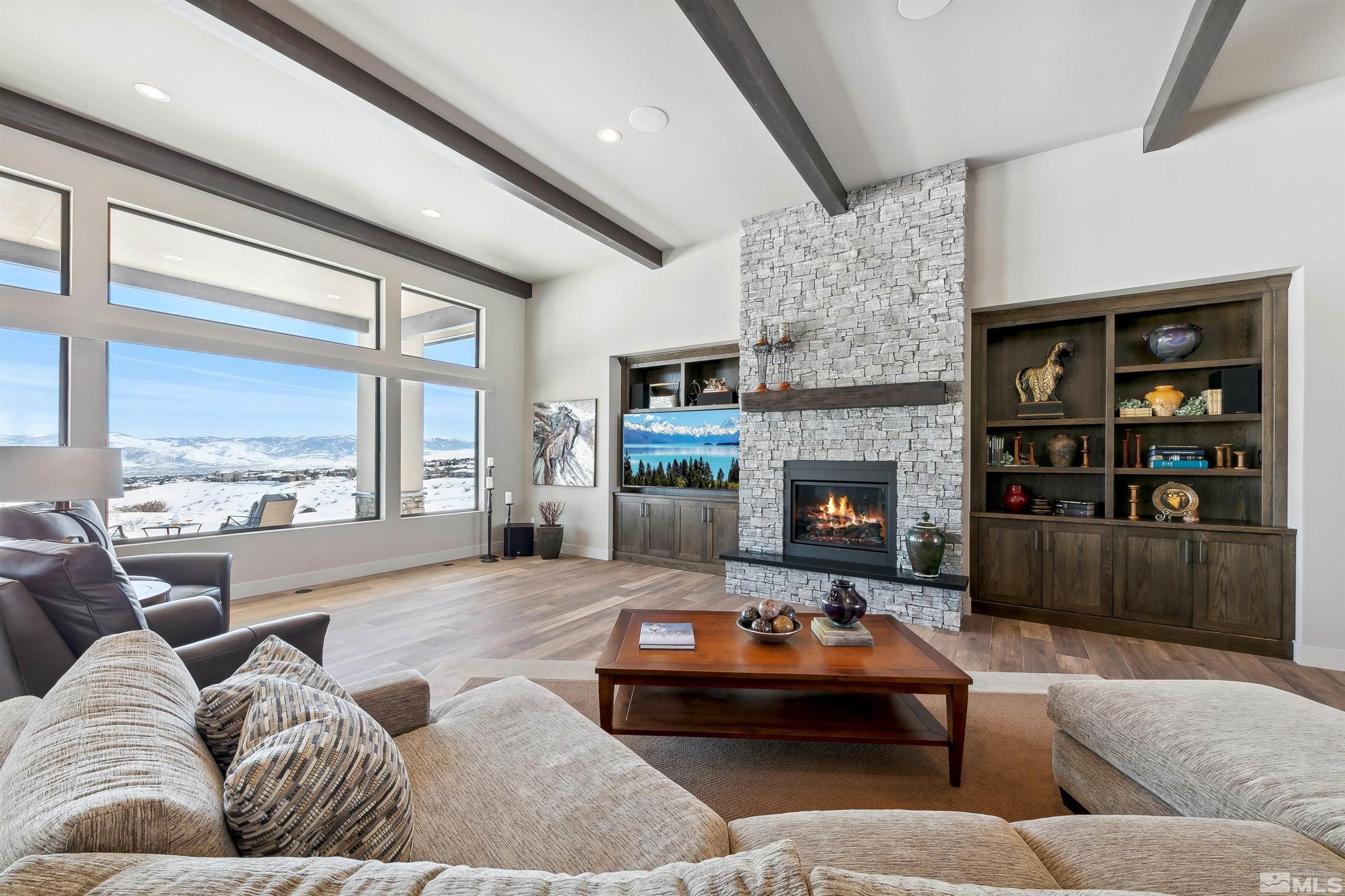 4110 Spotted Eagle Court Reno, NV 89511 - Photo 7 of 40 a living room with furniture fireplace and a large window