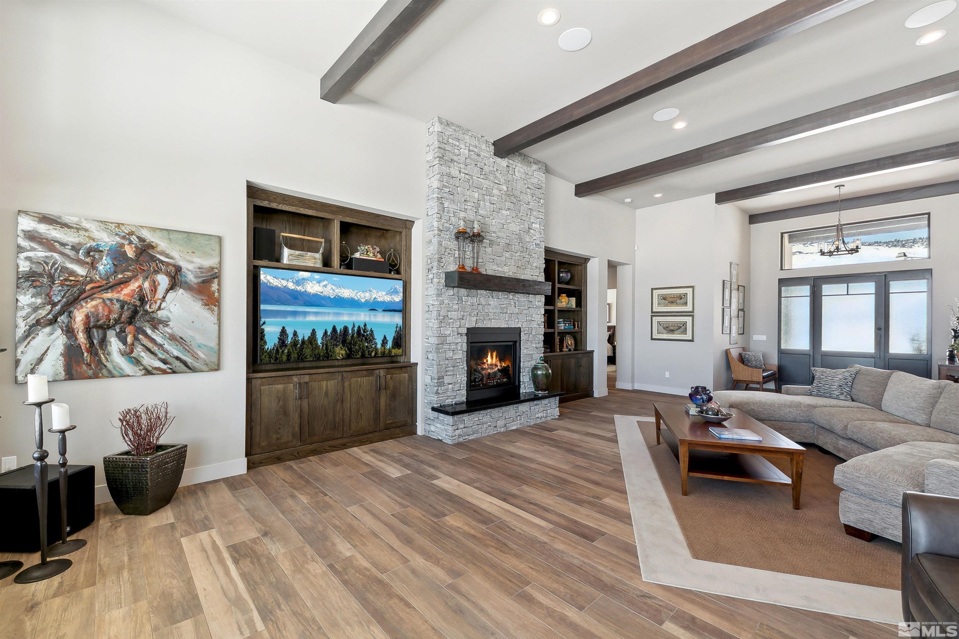 4110 Spotted Eagle Court Reno, NV 89511 - Photo 8 of 40 a living room with furniture and a fireplace