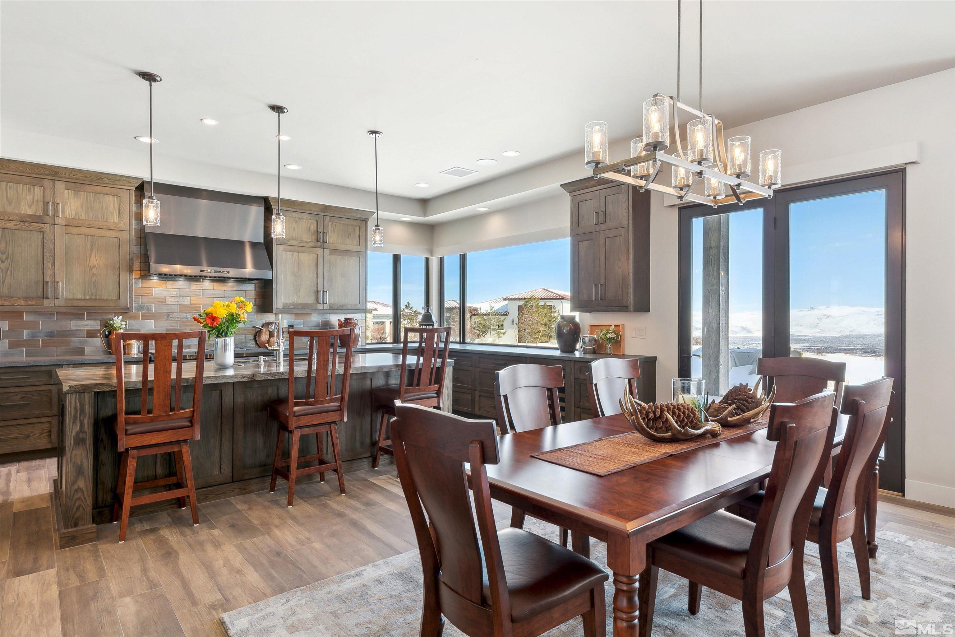 4110 Spotted Eagle Court Reno, NV 89511 - Photo 9 of 40 a view of a dining room with furniture window and wooden floor