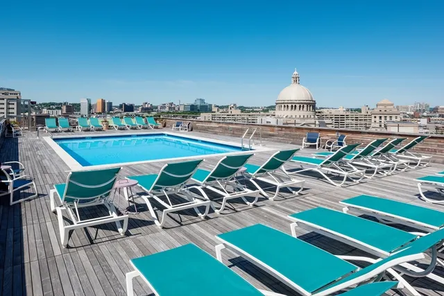 front view of a building with a lounge chairs