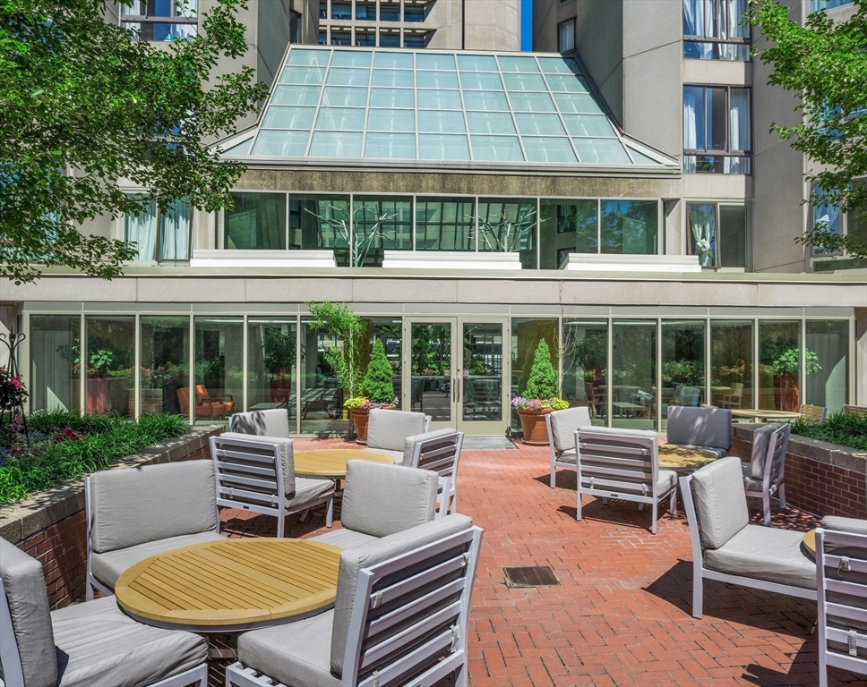 150 Huntington Avenue, Unit SJ3 Boston, MA 02115 - Photo 6 of 11 front view of a building with a lounge chairs