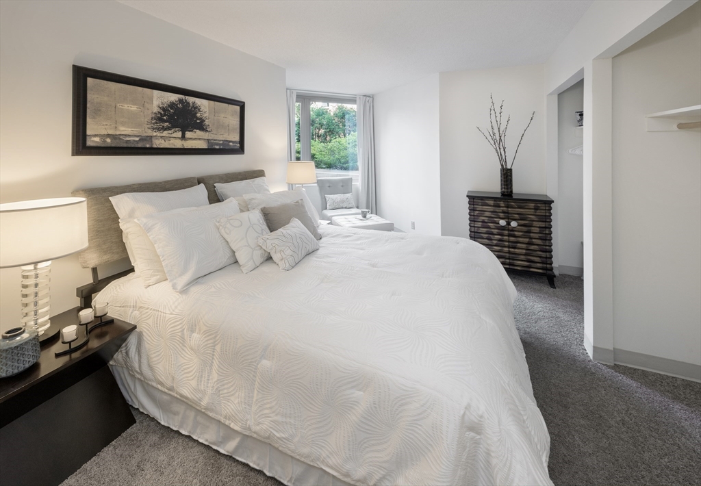 150 Huntington Avenue, Unit SJ3 Boston, MA 02115 - Photo 7 of 11 a bedroom with a bed and a painting on the wall