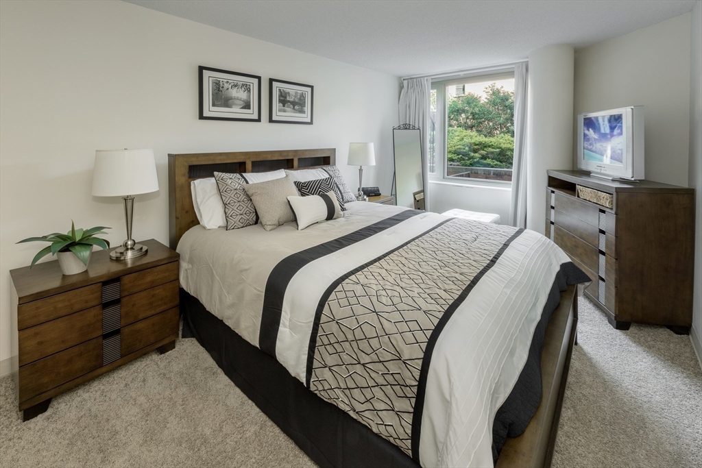 150 Huntington Avenue, Unit SJ3 Boston, MA 02115 - Photo 8 of 11 a bed room with a bed and a chair