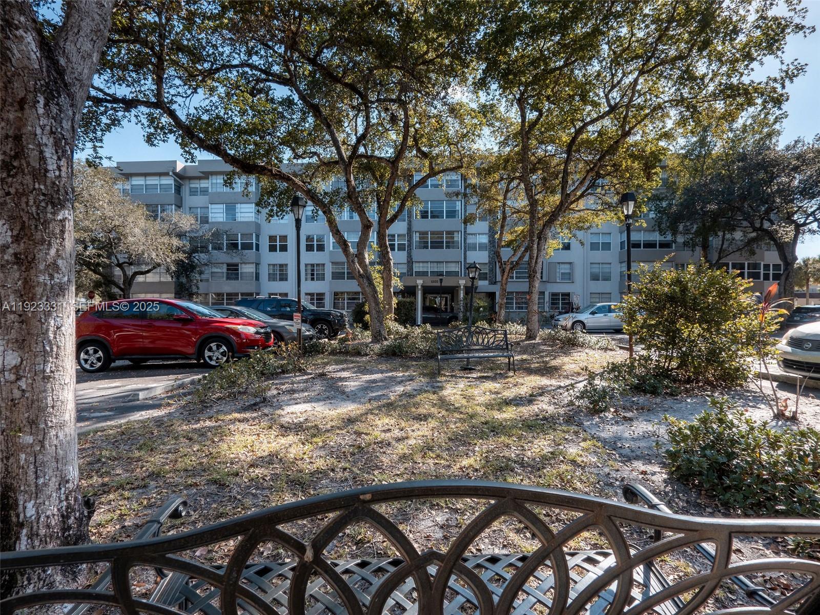 6600 Cypress Road, Unit 406 Plantation, FL 33317 - Photo 1 of 28 a view of a yard with car parked