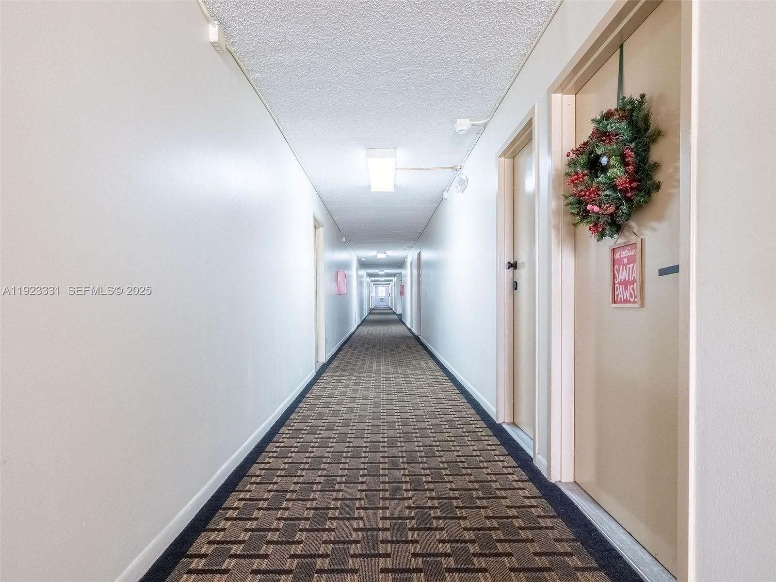 6600 Cypress Road, Unit 406 Plantation, FL 33317 - Photo 19 of 28 a view of a hallway to a house