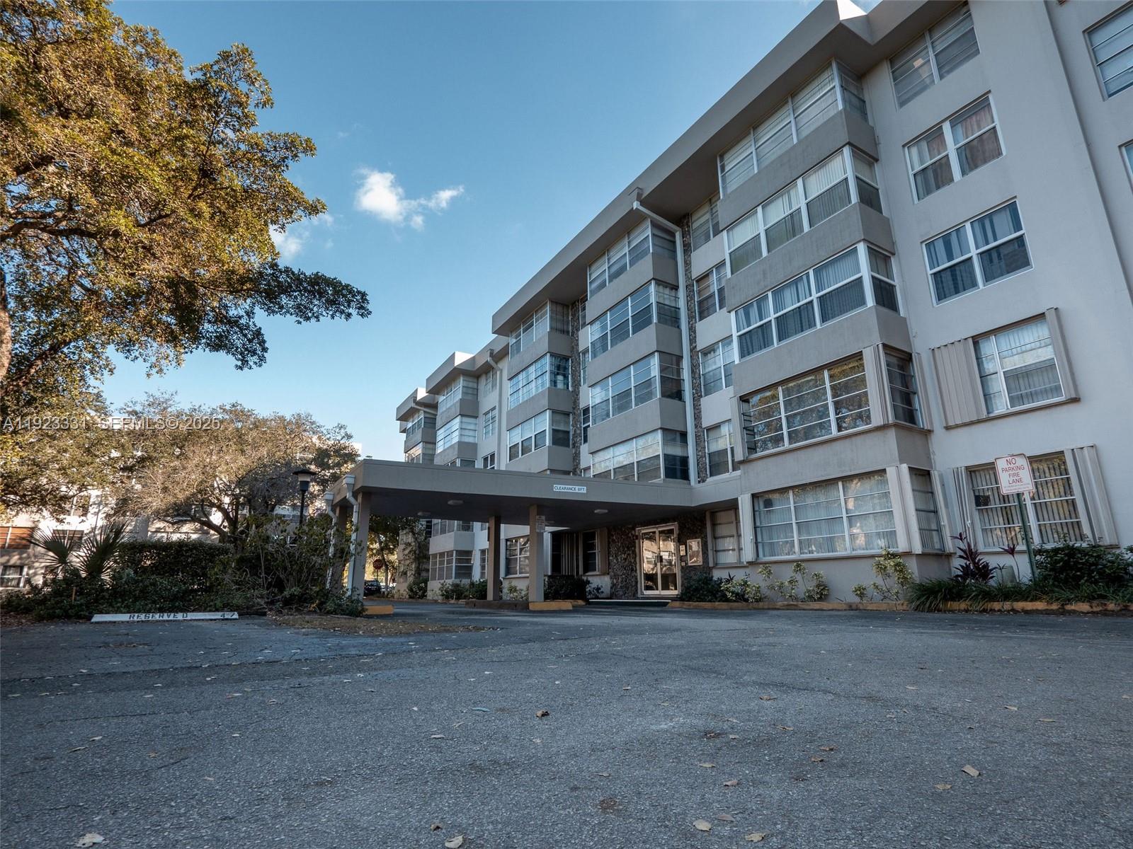 6600 Cypress Road, Unit 406 Plantation, FL 33317 - Photo 2 of 28 a view of a big building with many windows