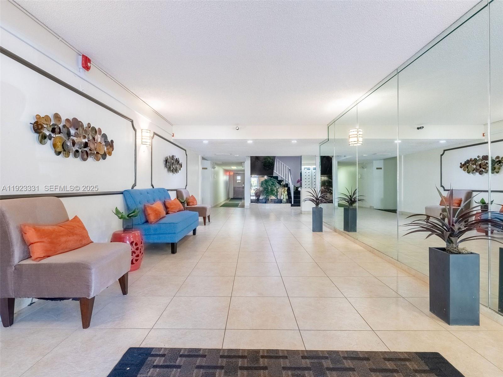 6600 Cypress Road, Unit 406 Plantation, FL 33317 - Photo 23 of 28 a living room with furniture and a potted plant