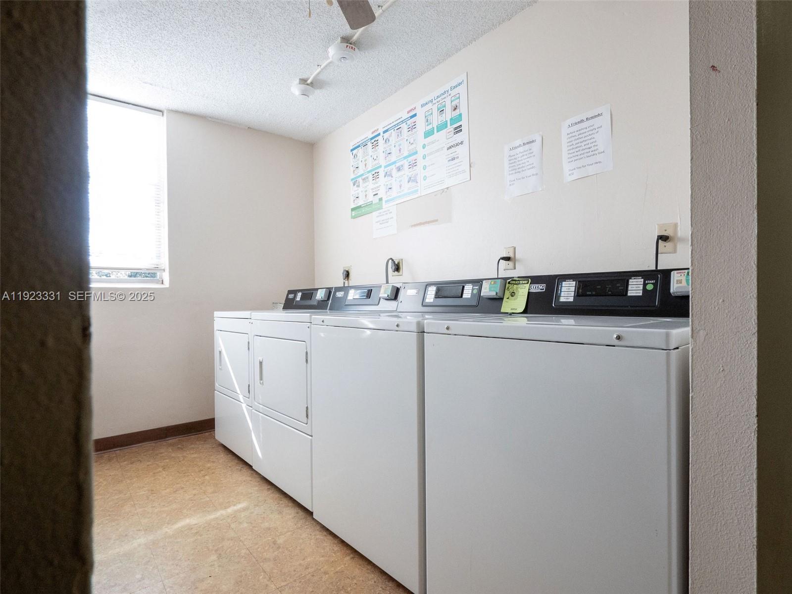 6600 Cypress Road, Unit 406 Plantation, FL 33317 - Photo 26 of 28 a utility room with stainless steel appliances a sink a window and a mirror
