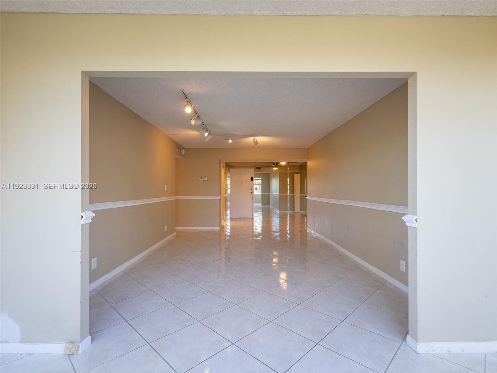 6600 Cypress Road, Unit 406 Plantation, FL 33317 - Photo 10 of 28 a view of an empty room with a window