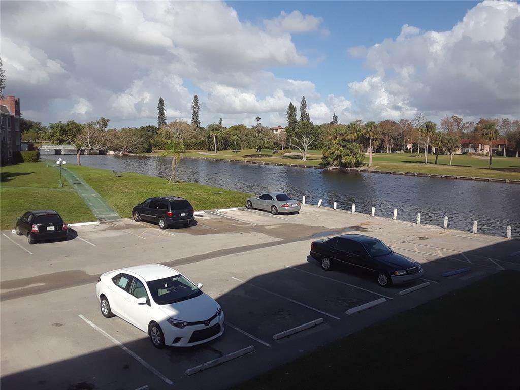 3750 Inverrary Drive, Unit 2K Lauderhill, FL 33319 - Photo 13 of 13 a view of a lake with a terrace