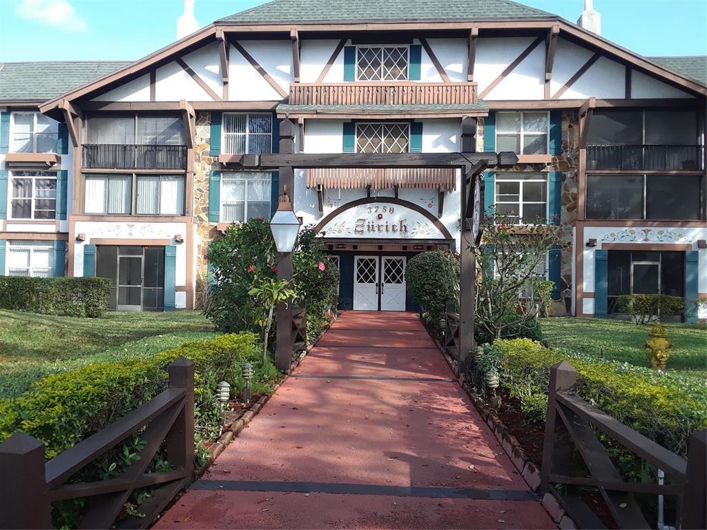 3750 Inverrary Drive, Unit 2K Lauderhill, FL 33319 - Photo 2 of 13 a front view of a house with a yard