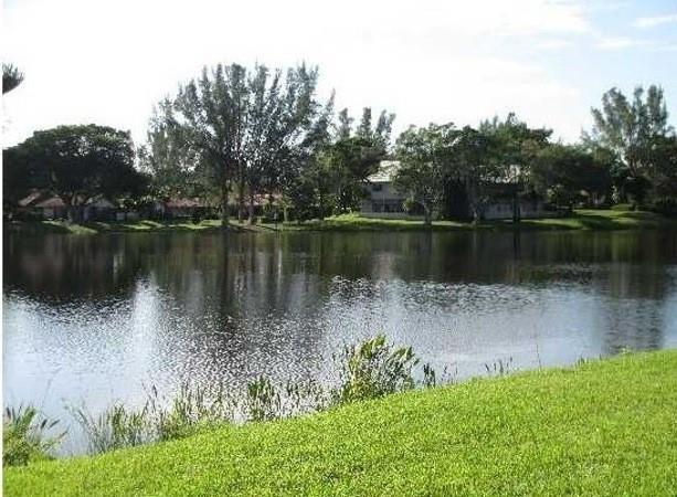 3750 Inverrary Drive, Unit 2K Lauderhill, FL 33319 - Photo 7 of 13 a body of water with a tree in the background