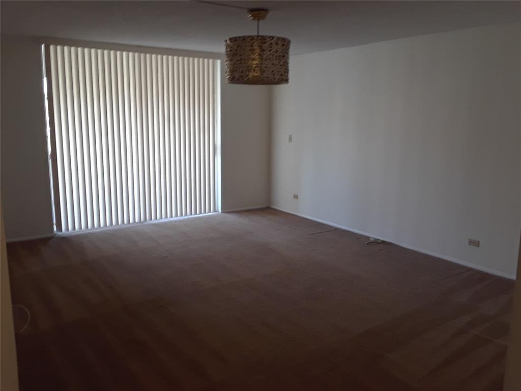 3750 Inverrary Drive, Unit 2K Lauderhill, FL 33319 - Photo 10 of 13 a view of a livingroom with an empty space