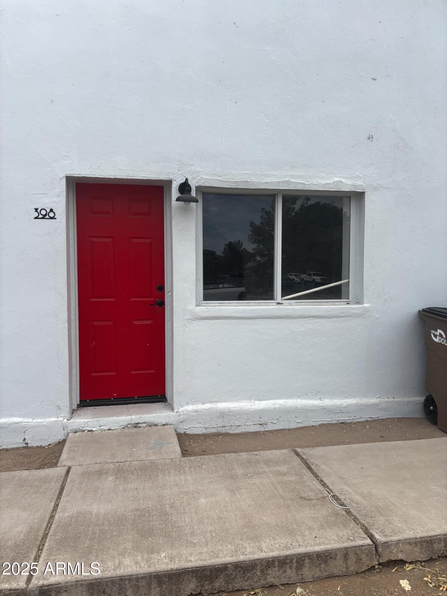 a view of a house with red door