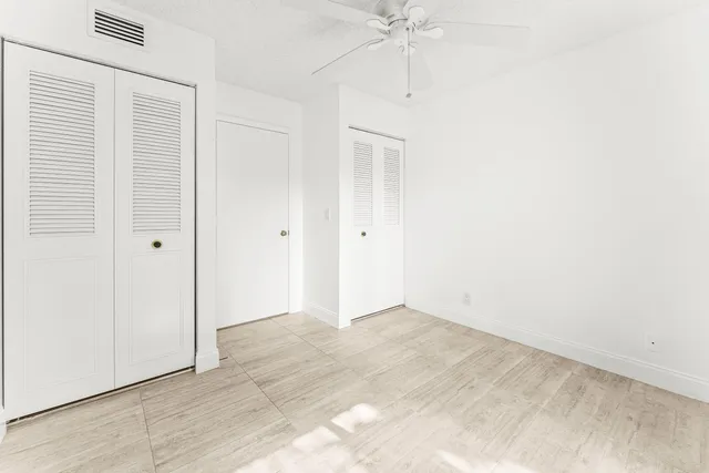 an empty room with fan