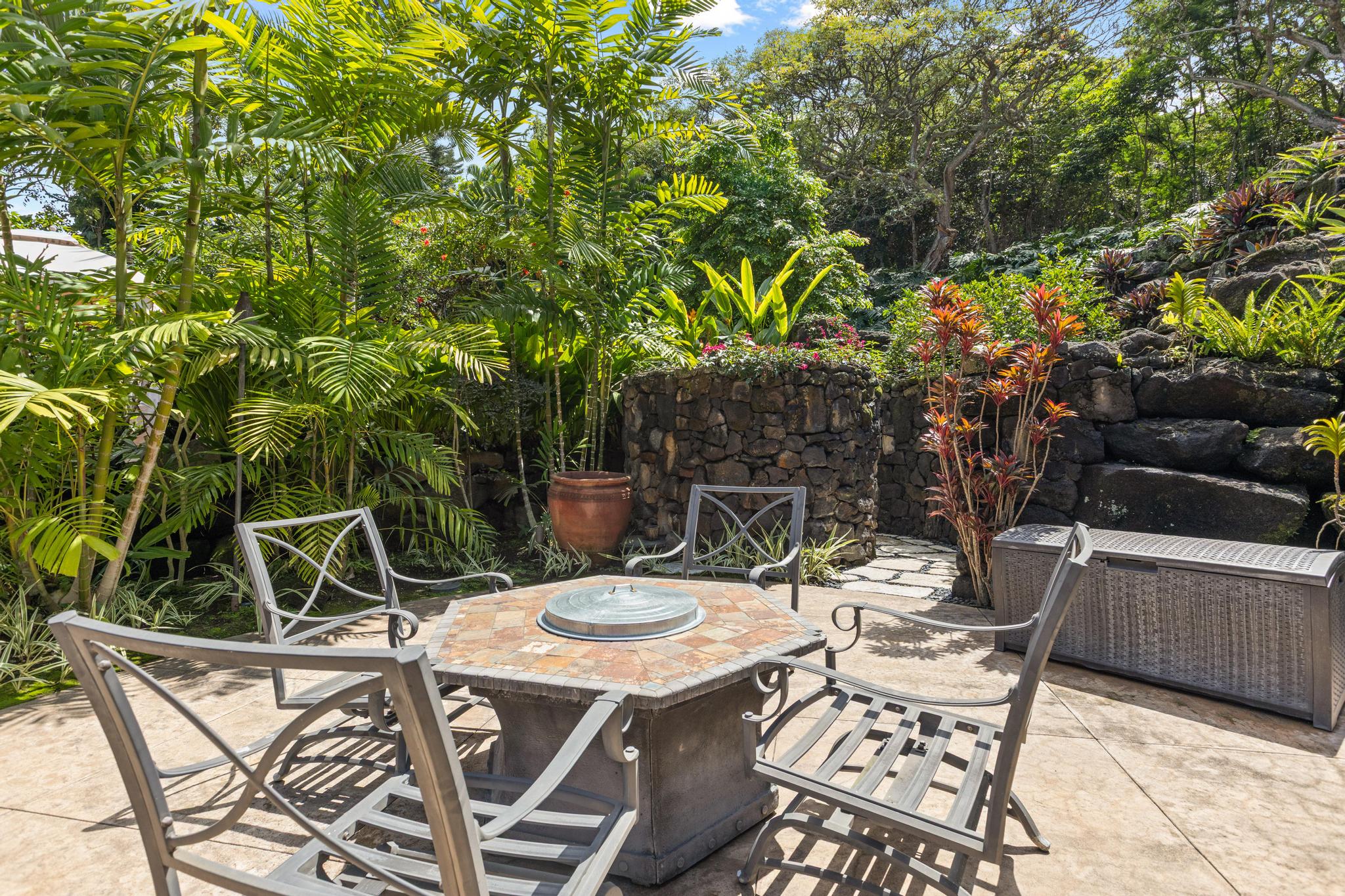 78-6737 Walua Road Kailua-Kona, HI 96740 - Photo 20 of 21 a view of a patio with table and chairs potted plants and a large tree
