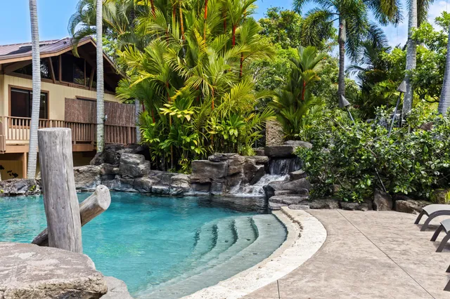 a view of a swimming pool with a patio
