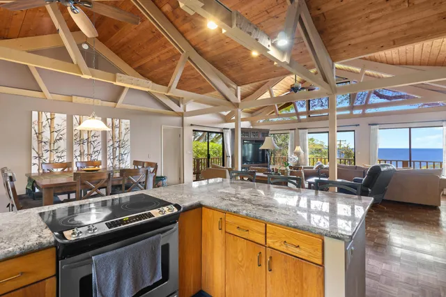 a kitchen with granite countertop a sink and a counter top space