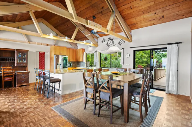 a view of a dining room with furniture window and outside view