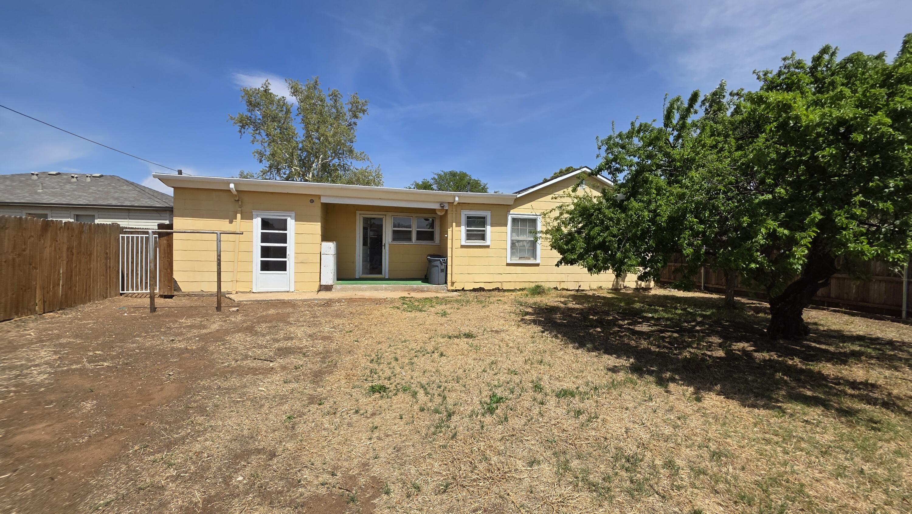 2403 38th Street Lubbock, TX 79412 - Photo 16 of 17 a front view of a house with a yard