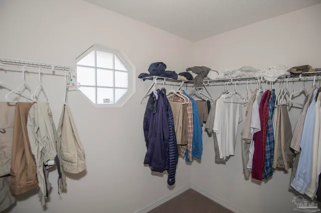 a bedroom with two beds and a table