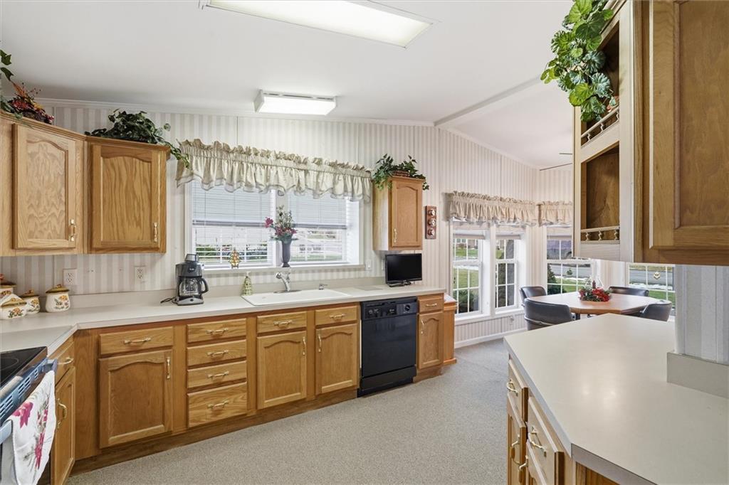 2001 Pond Lane Elizabeth, PA 15037 - Photo 11 of 38 a kitchen with a sink stove and cabinets