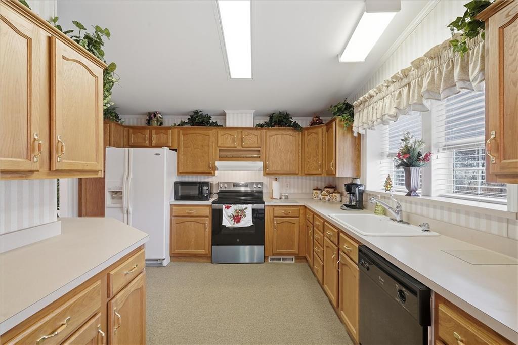 2001 Pond Lane Elizabeth, PA 15037 - Photo 12 of 38 a kitchen with refrigerator and cabinets