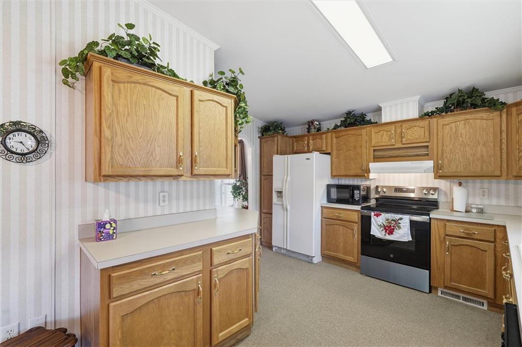 2001 Pond Lane Elizabeth, PA 15037 - Photo 13 of 38 a kitchen with stainless steel appliances granite countertop a refrigerator sink and stove
