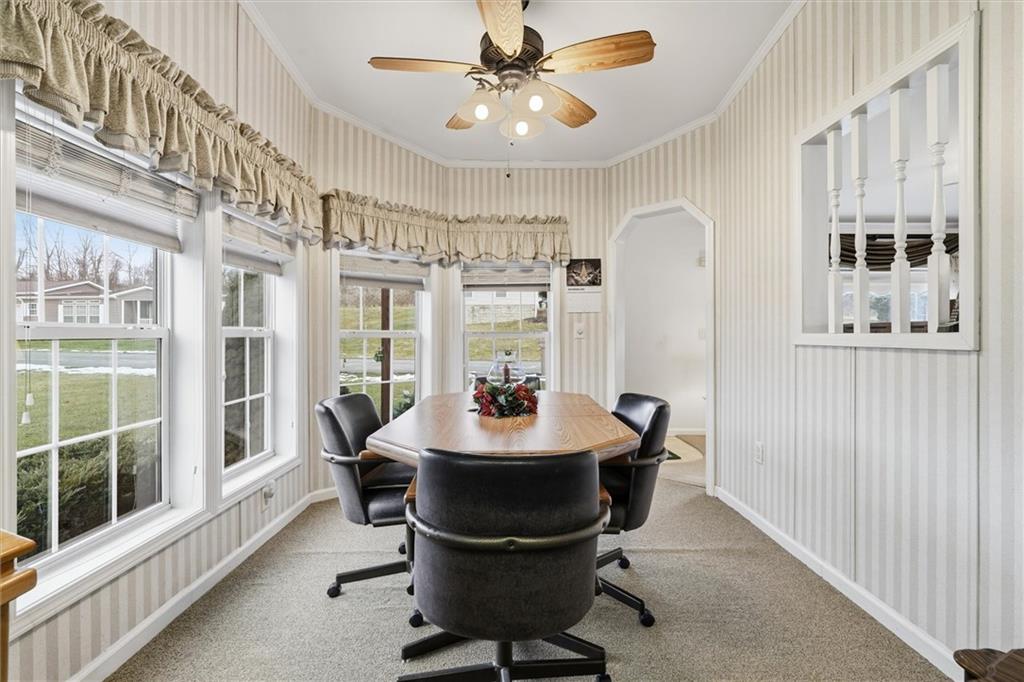 2001 Pond Lane Elizabeth, PA 15037 - Photo 16 of 38 a dining room with furniture a chandelier and window