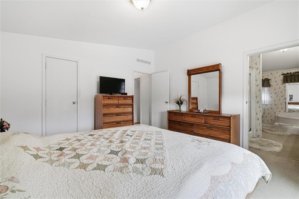 2001 Pond Lane Elizabeth, PA 15037 - Photo 20 of 38 a bedroom with a bed and a flat screen tv