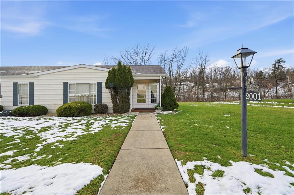 2001 Pond Lane Elizabeth, PA 15037 - Photo 2 of 38 a front view of a house with garden