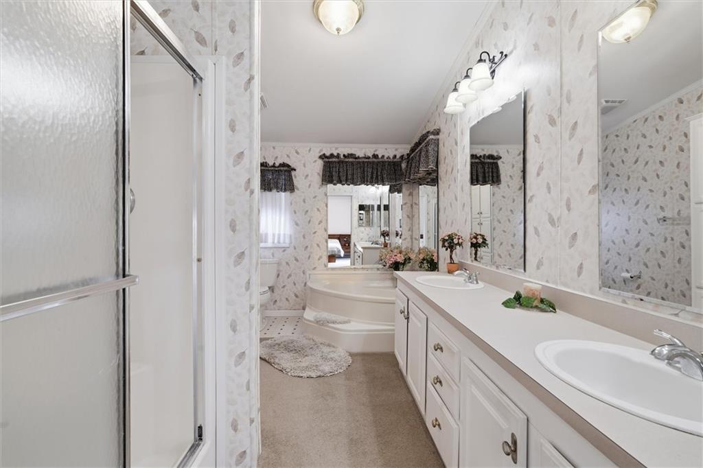 2001 Pond Lane Elizabeth, PA 15037 - Photo 21 of 38 a spacious bathroom with a double vanity sink a mirror and a shower