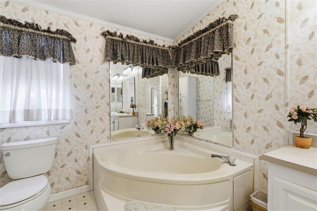 2001 Pond Lane Elizabeth, PA 15037 - Photo 23 of 38 a white bath tub sitting next to a white toilet