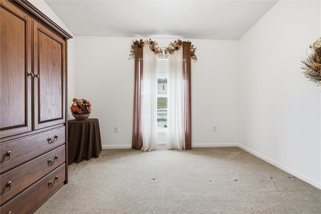 2001 Pond Lane Elizabeth, PA 15037 - Photo 26 of 38 an empty room with a dresser and mirror