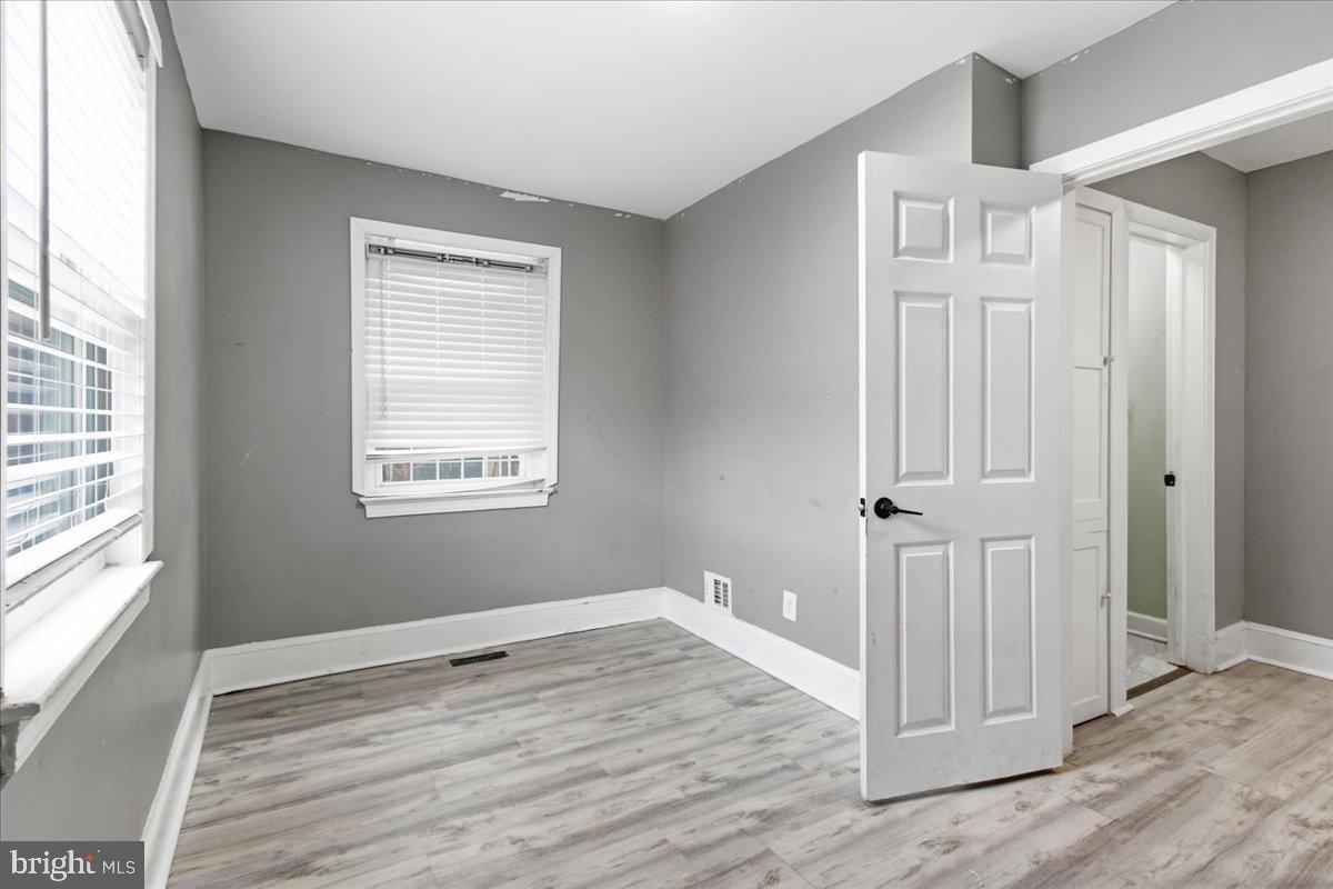 206 36th Street Southeast Washington, DC 20019 - Photo 15 of 28 a view of empty room with wooden floor and fan