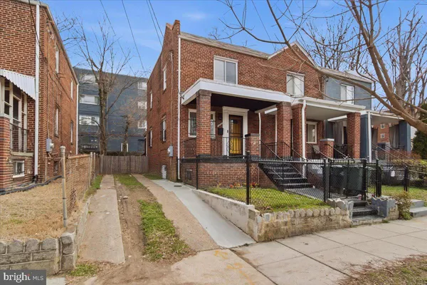 a view of a building with sitting area