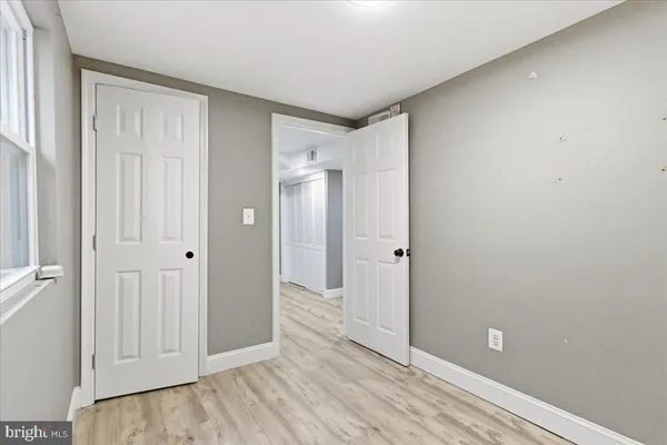 a view of a bathroom with wooden floor
