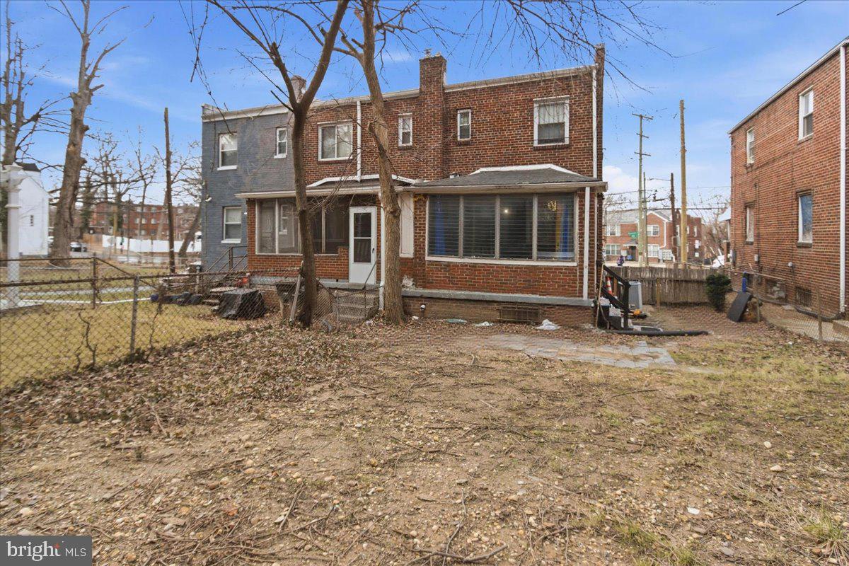 206 36th Street Southeast Washington, DC 20019 - Photo 27 of 28 a view of a brick house with many windows