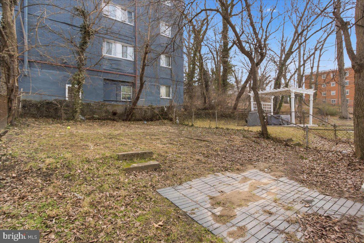 206 36th Street Southeast Washington, DC 20019 - Photo 28 of 28 a brick house with a yard and trees