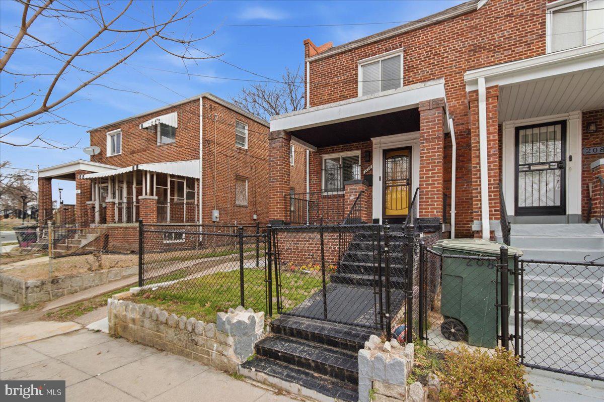 206 36th Street Southeast Washington, DC 20019 - Photo 3 of 28 front view of a house with a yard