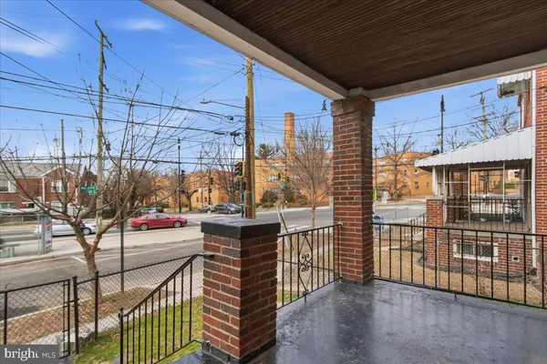 a view of a balcony with iron fence