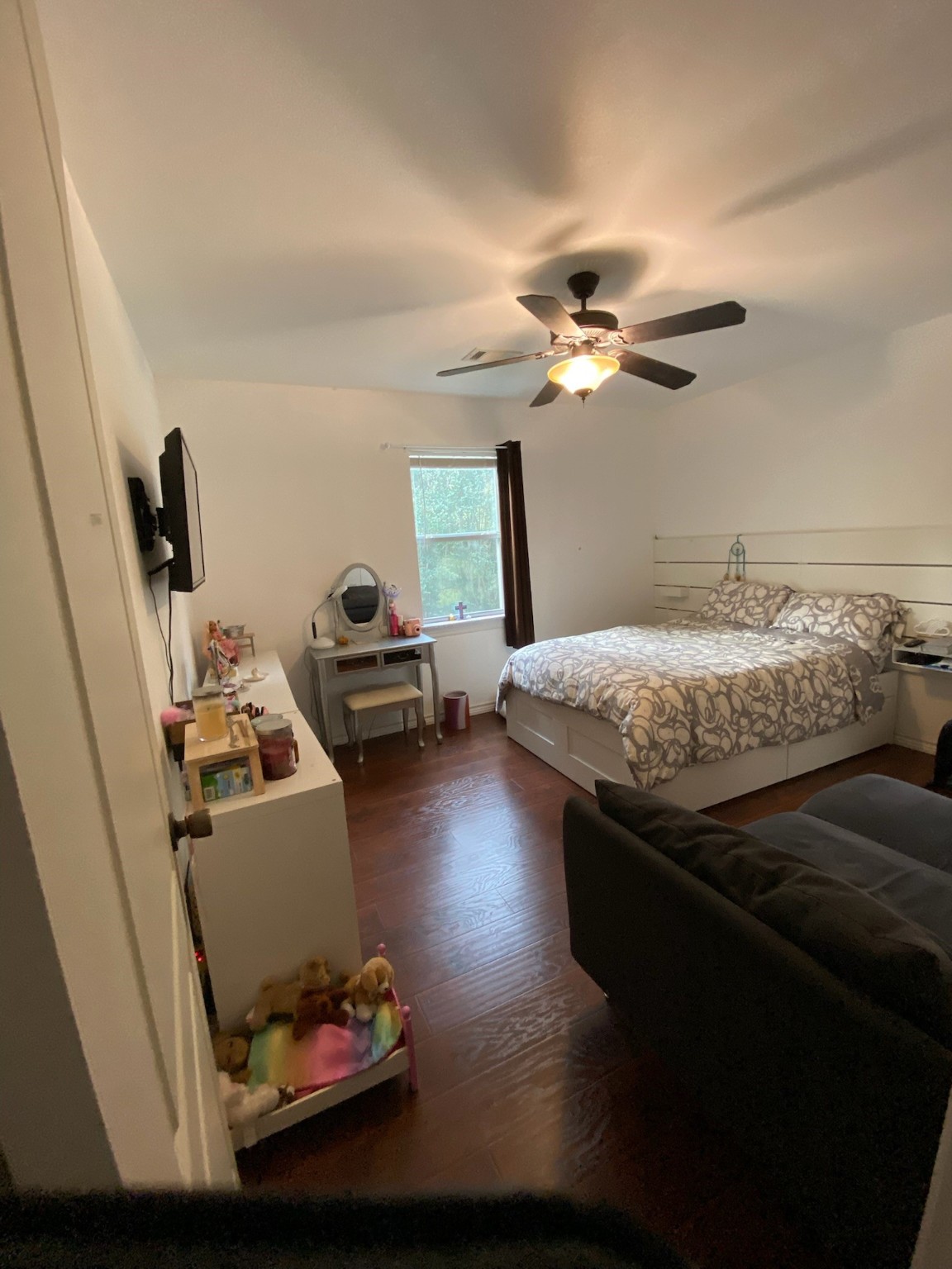195 Rim Rock Road Onalaska, TX 77360 - Photo 16 of 45 a bedroom with furniture and a chandelier