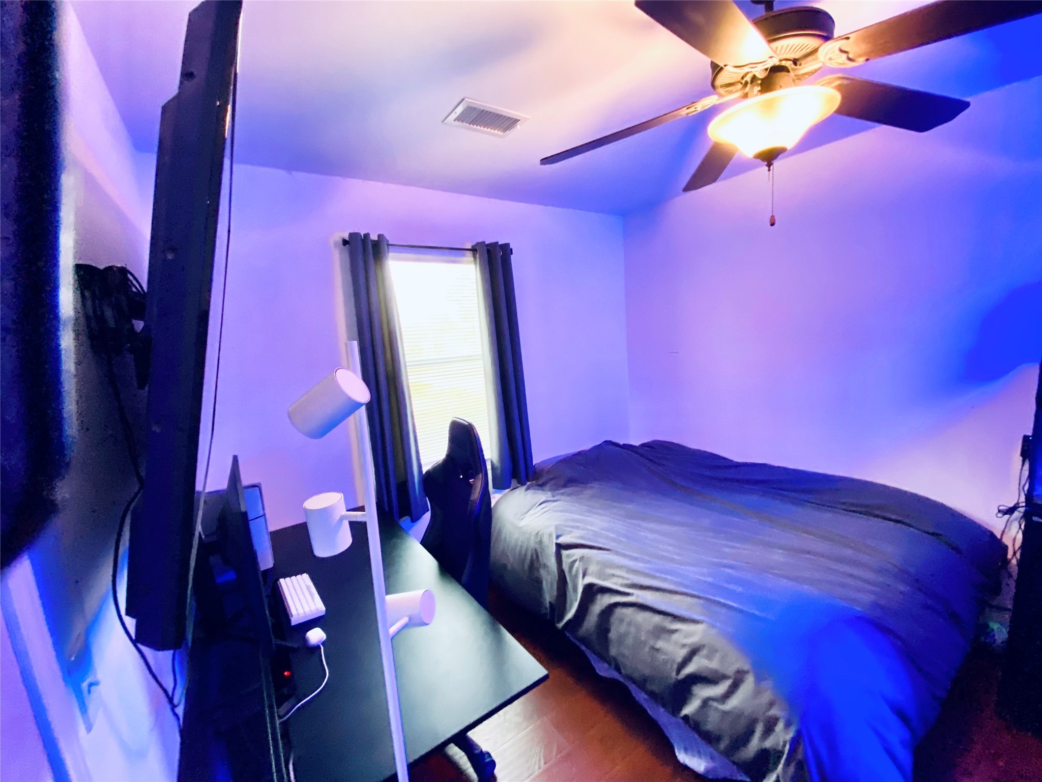 195 Rim Rock Road Onalaska, TX 77360 - Photo 17 of 45 a bedroom with a bed and a mirror