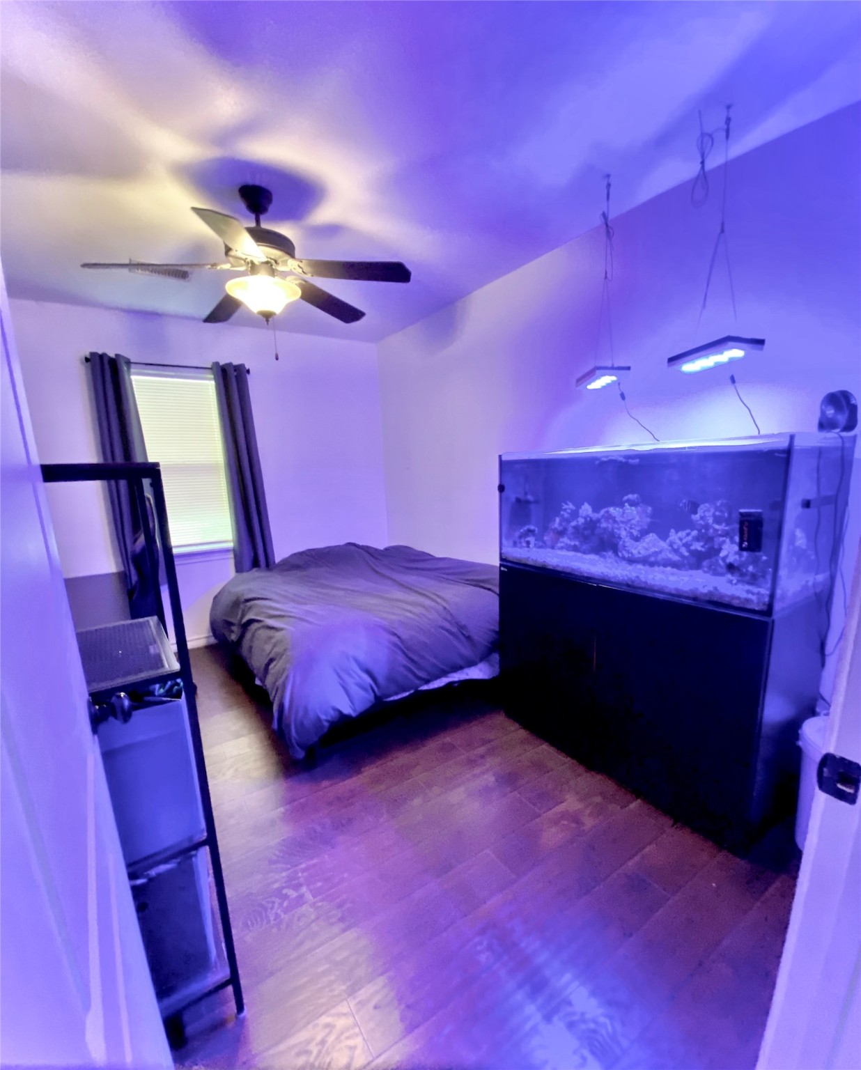 195 Rim Rock Road Onalaska, TX 77360 - Photo 18 of 45 a bed room with a bed and a fireplace