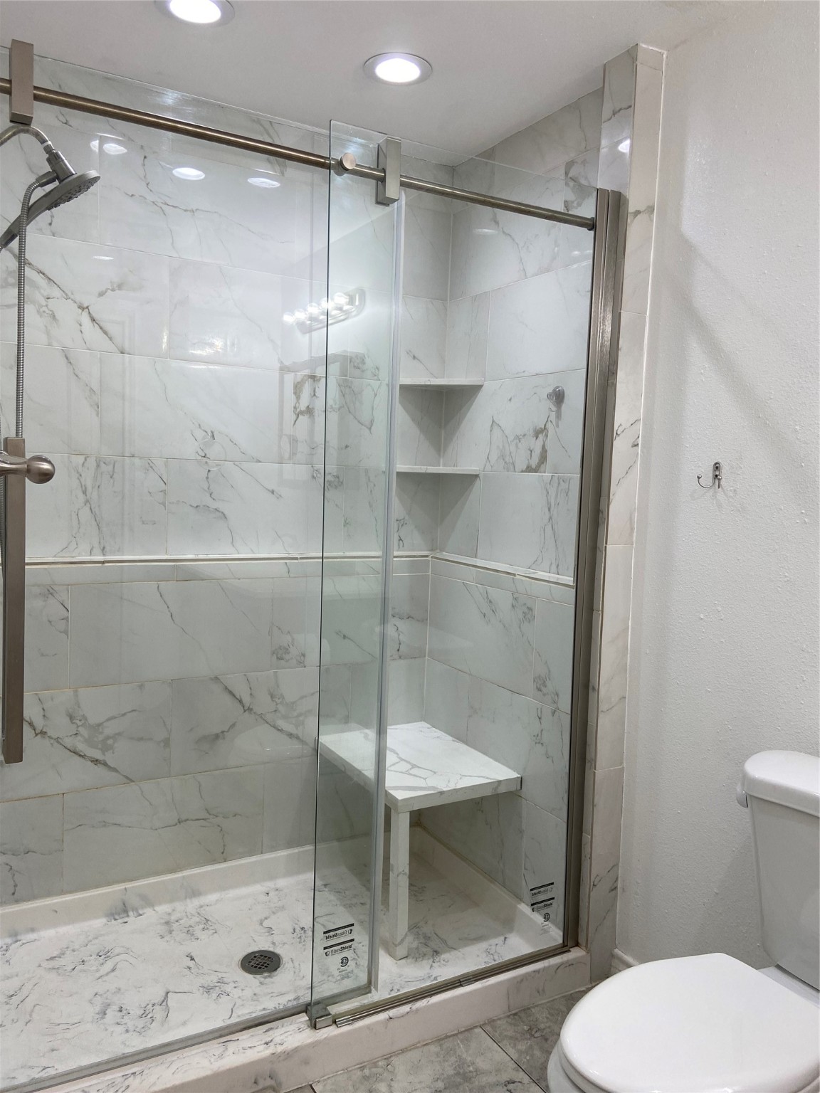 195 Rim Rock Road Onalaska, TX 77360 - Photo 27 of 45 a bathroom with a shower and toilet