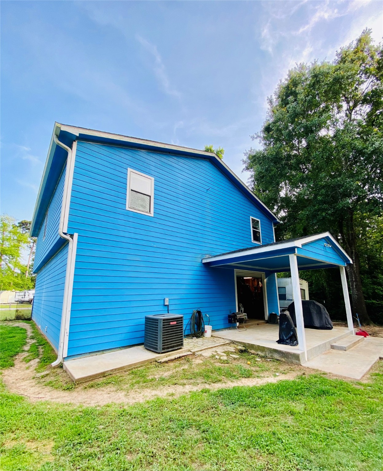 195 Rim Rock Road Onalaska, TX 77360 - Photo 42 of 45 a view of a house with a yard and sitting area